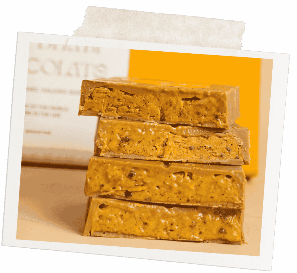 Close-up of Snaap Abu Dhabi Chocolate—saffron and tahina chocolate bar with gold leaves and a nostalgic crunch.